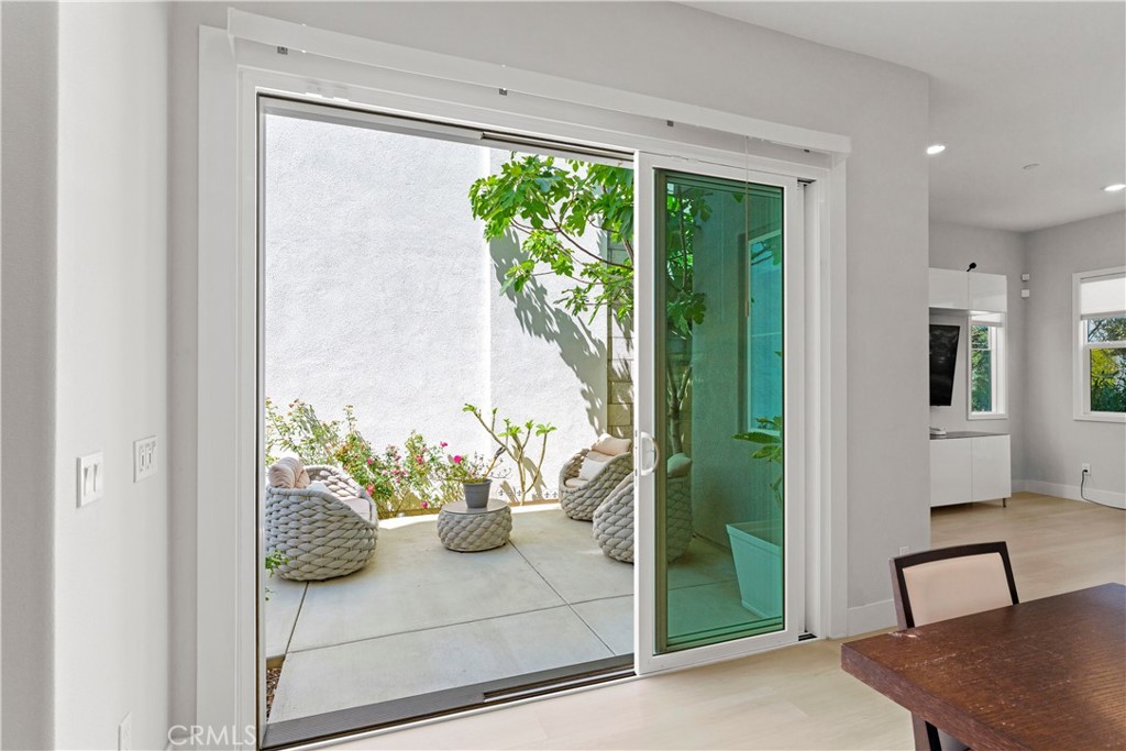 259 Chorus Irvine, CA 92618 - Photo 17 of 56 a white vase with flowers and white wooden cabinets