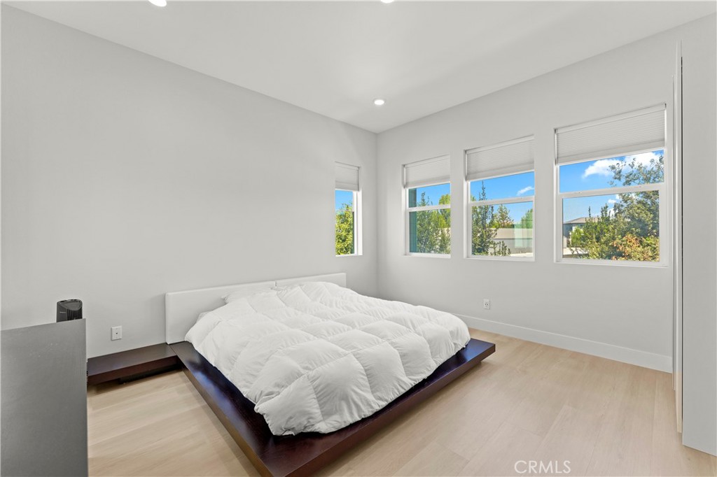 259 Chorus Irvine, CA 92618 - Photo 18 of 56 a bedroom with a bed and window