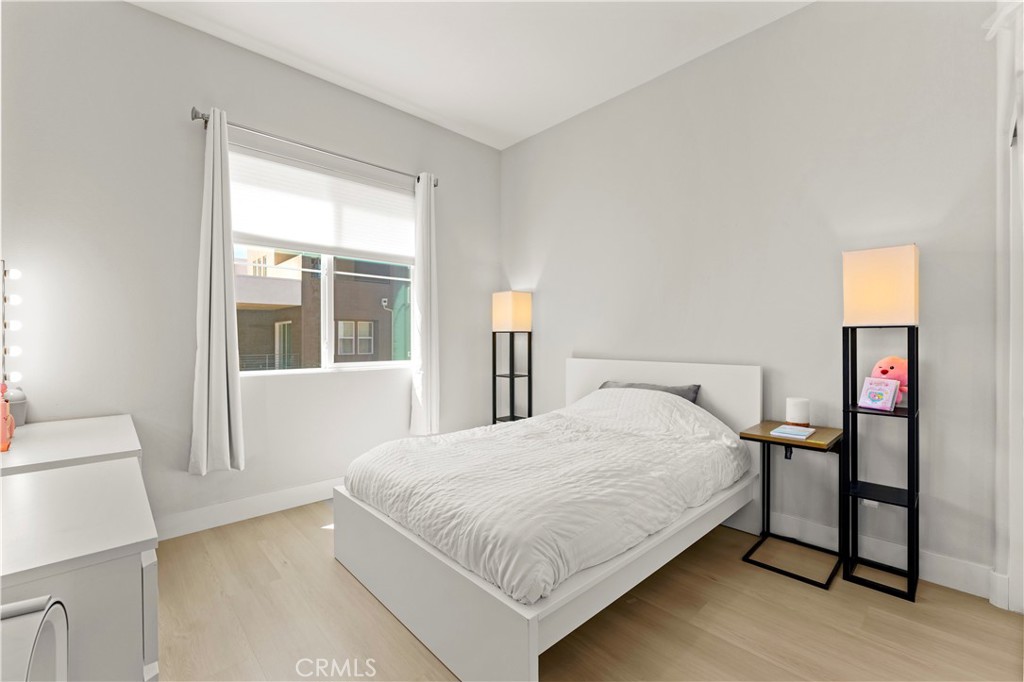 259 Chorus Irvine, CA 92618 - Photo 22 of 56 a large bed sitting in a bedroom next to a window
