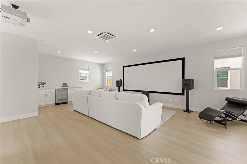 259 Chorus Irvine, CA 92618 - Photo 23 of 56 a living room with furniture and a flat screen tv