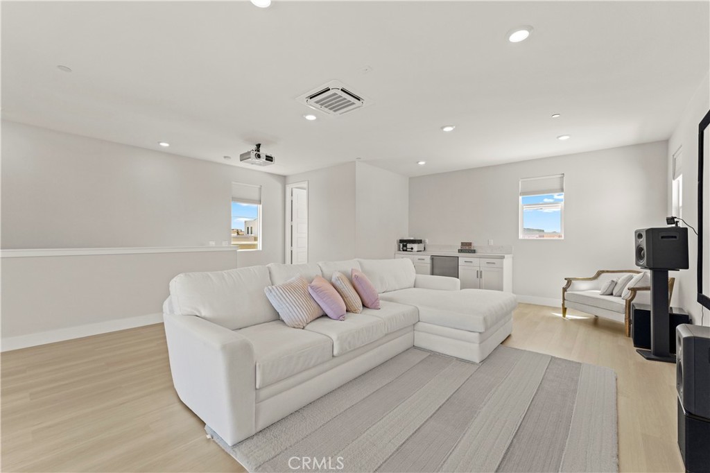 259 Chorus Irvine, CA 92618 - Photo 24 of 56 a living room with furniture and a wooden floor