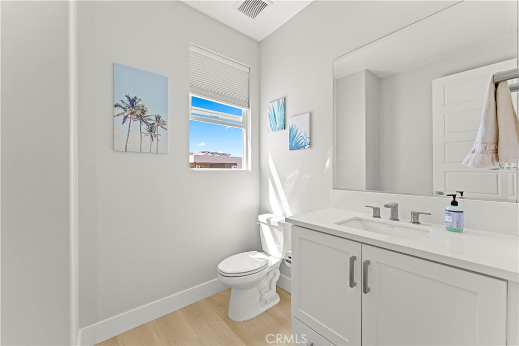 259 Chorus Irvine, CA 92618 - Photo 26 of 56 a bathroom with a toilet sink and mirror