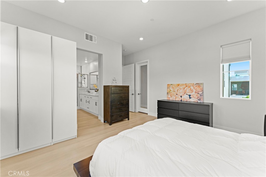 259 Chorus Irvine, CA 92618 - Photo 32 of 56 a bedroom with a bed and dresser