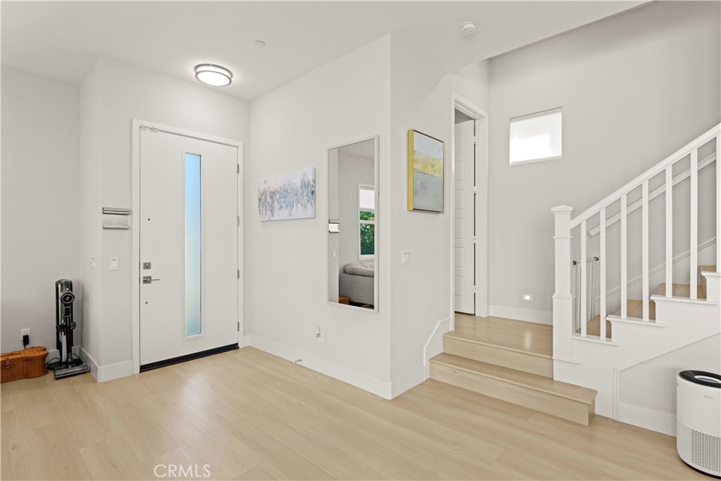 259 Chorus Irvine, CA 92618 - Photo 35 of 56 a view of a livingroom with wooden floor and stairs