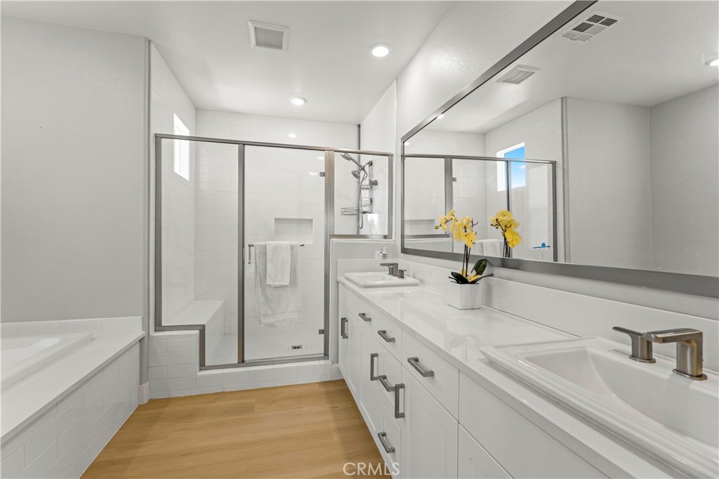 259 Chorus Irvine, CA 92618 - Photo 36 of 56 a spacious bathroom with a tub sink shower and mirror