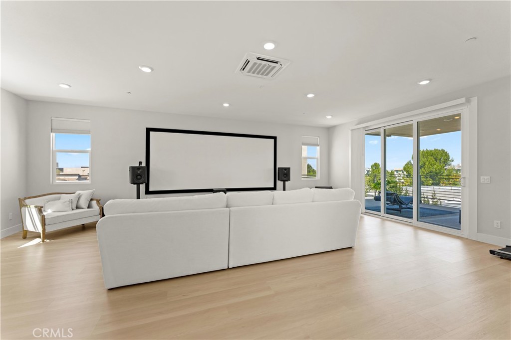 259 Chorus Irvine, CA 92618 - Photo 39 of 56 a living room with furniture and a flat screen tv