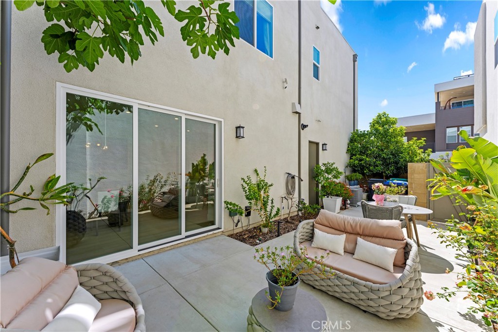259 Chorus Irvine, CA 92618 - Photo 46 of 56 a building outdoor space with patio furniture