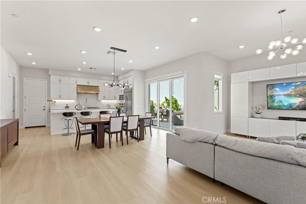 259 Chorus Irvine, CA 92618 - Photo 10 of 56 a living room with furniture and a flat screen tv