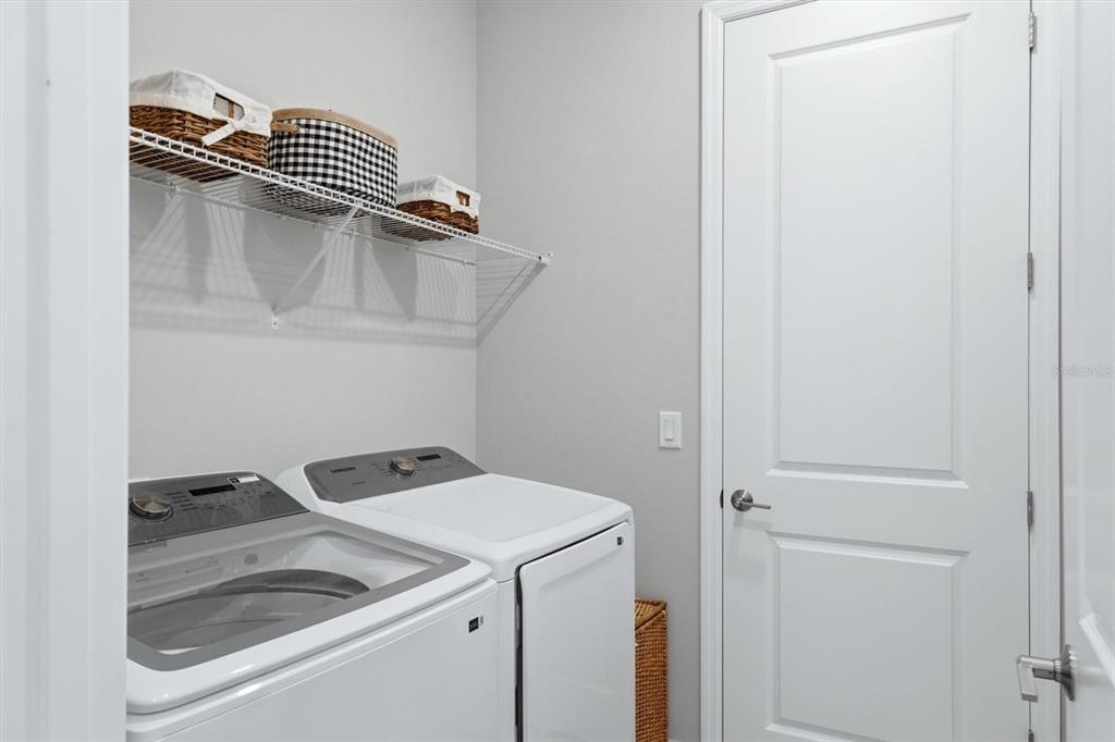 9268 Tequila Sunrise Drive Sarasota, FL 34241 - Photo 29 of 56 a utility room with dryer and washer