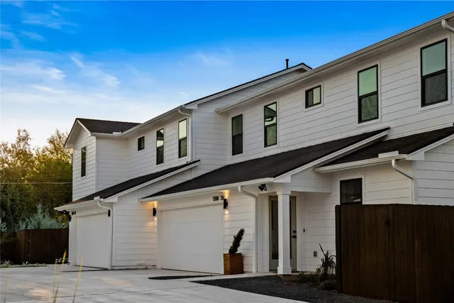 a front view of a house with garage