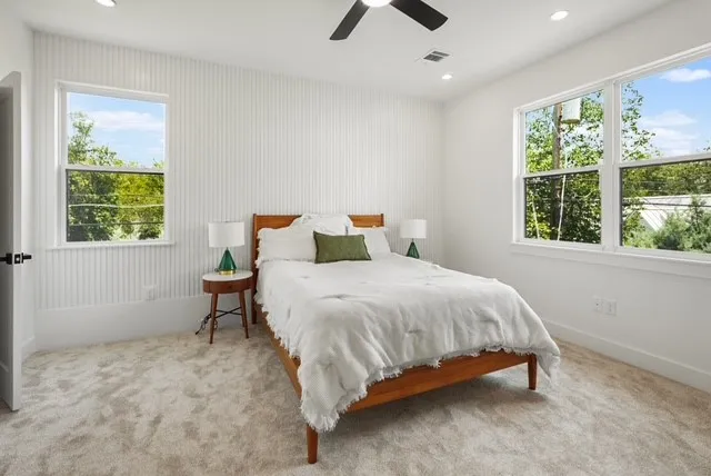 a bedroom with a bed and window