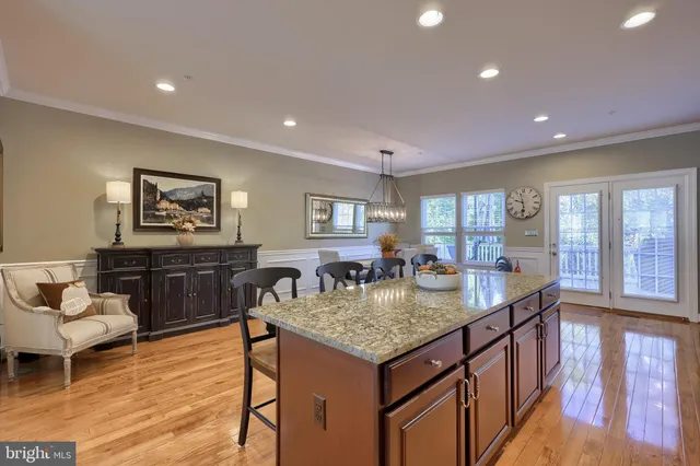 a view of kitchen island with granite countertop living room
