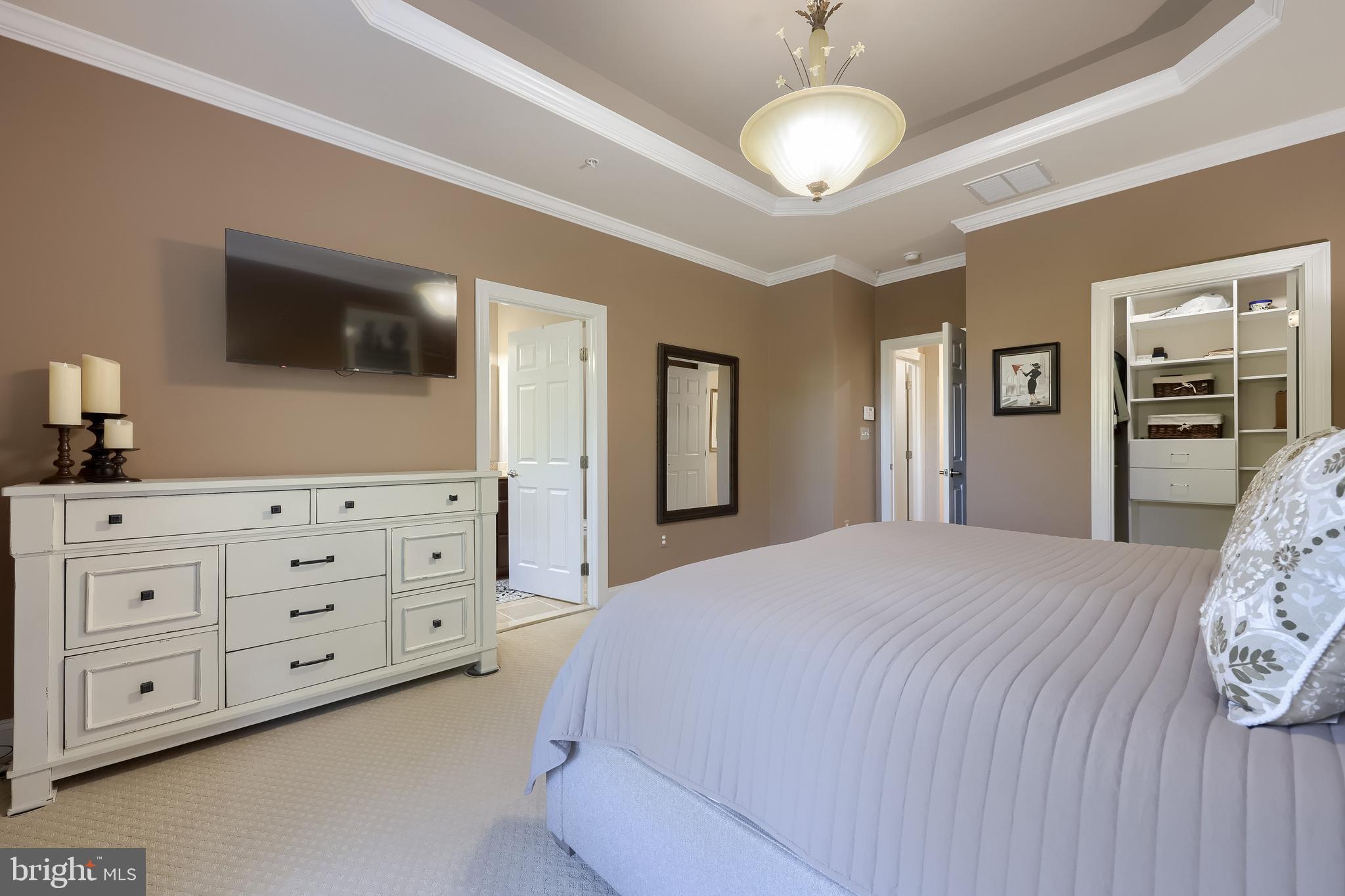 938 Stonehaven Way York, PA 17403 - Photo 20 of 45 a bedroom with a large bed and a tv