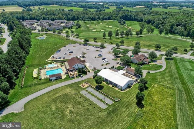 an aerial view of a house with outdoor space swimming pool and outdoor seating