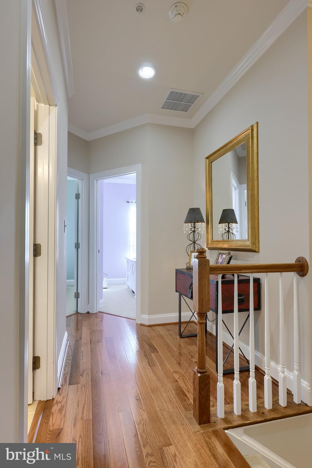 938 Stonehaven Way York, PA 17403 - Photo 27 of 45 a view of a hallway with wooden floor and staircase