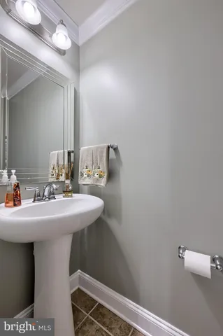 a view of a porch with furniture and garden