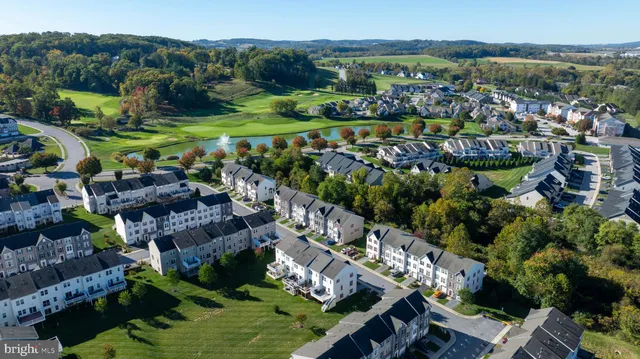 a dining room with lots of furniture and wooden floor