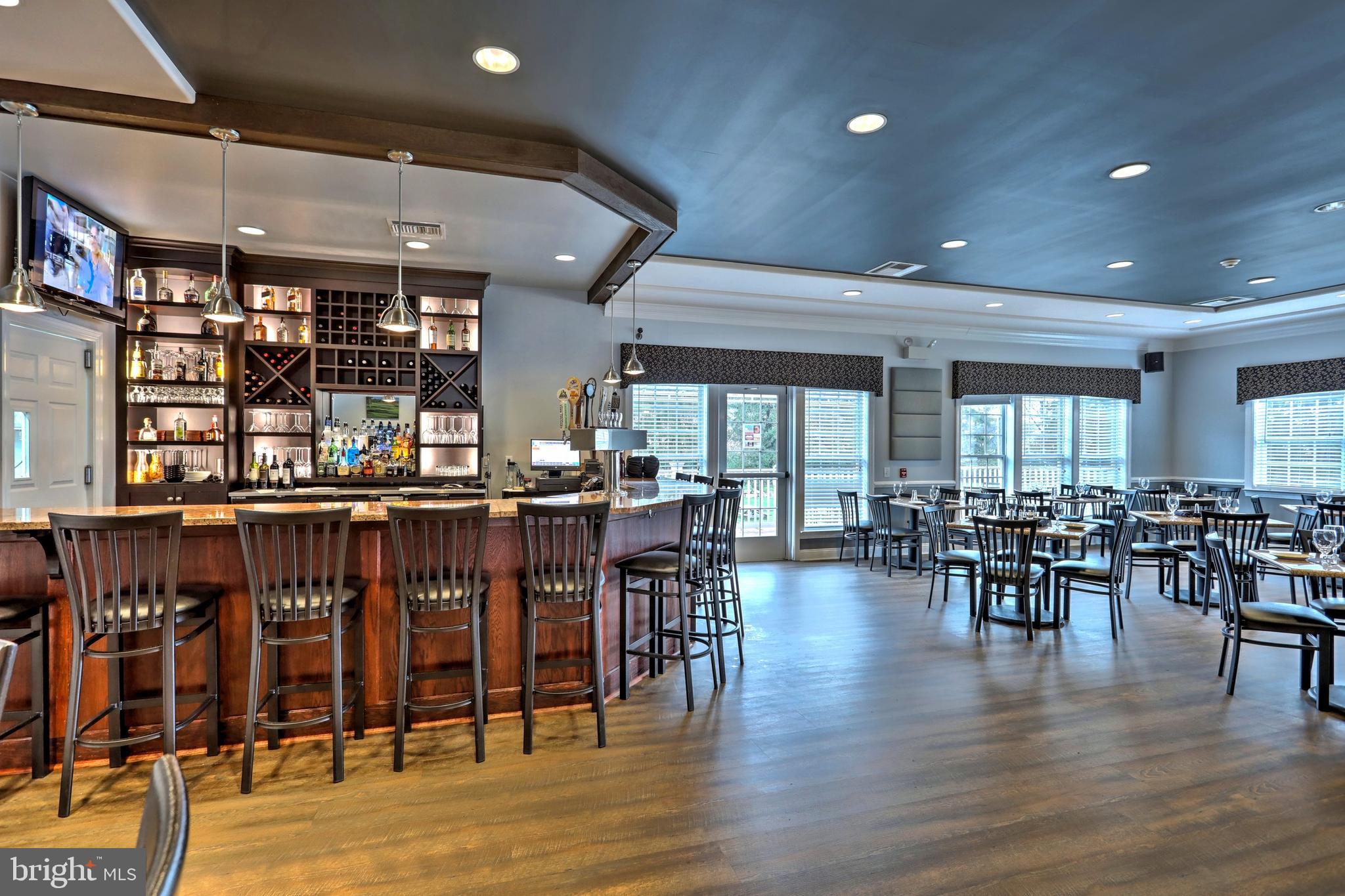 938 Stonehaven Way York, PA 17403 - Photo 43 of 45 a dining room with lots of furniture and wooden floor