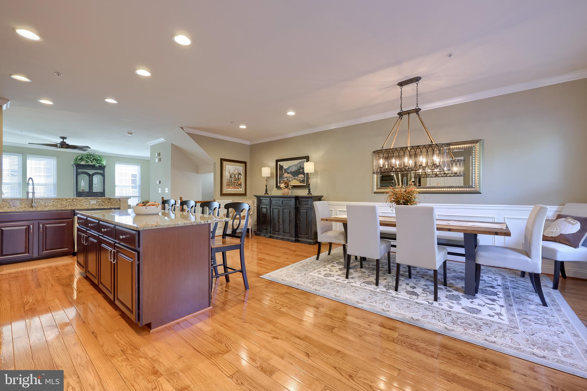 938 Stonehaven Way York, PA 17403 - Photo 6 of 45 a living room with couches chairs and kitchen view with wooden floor