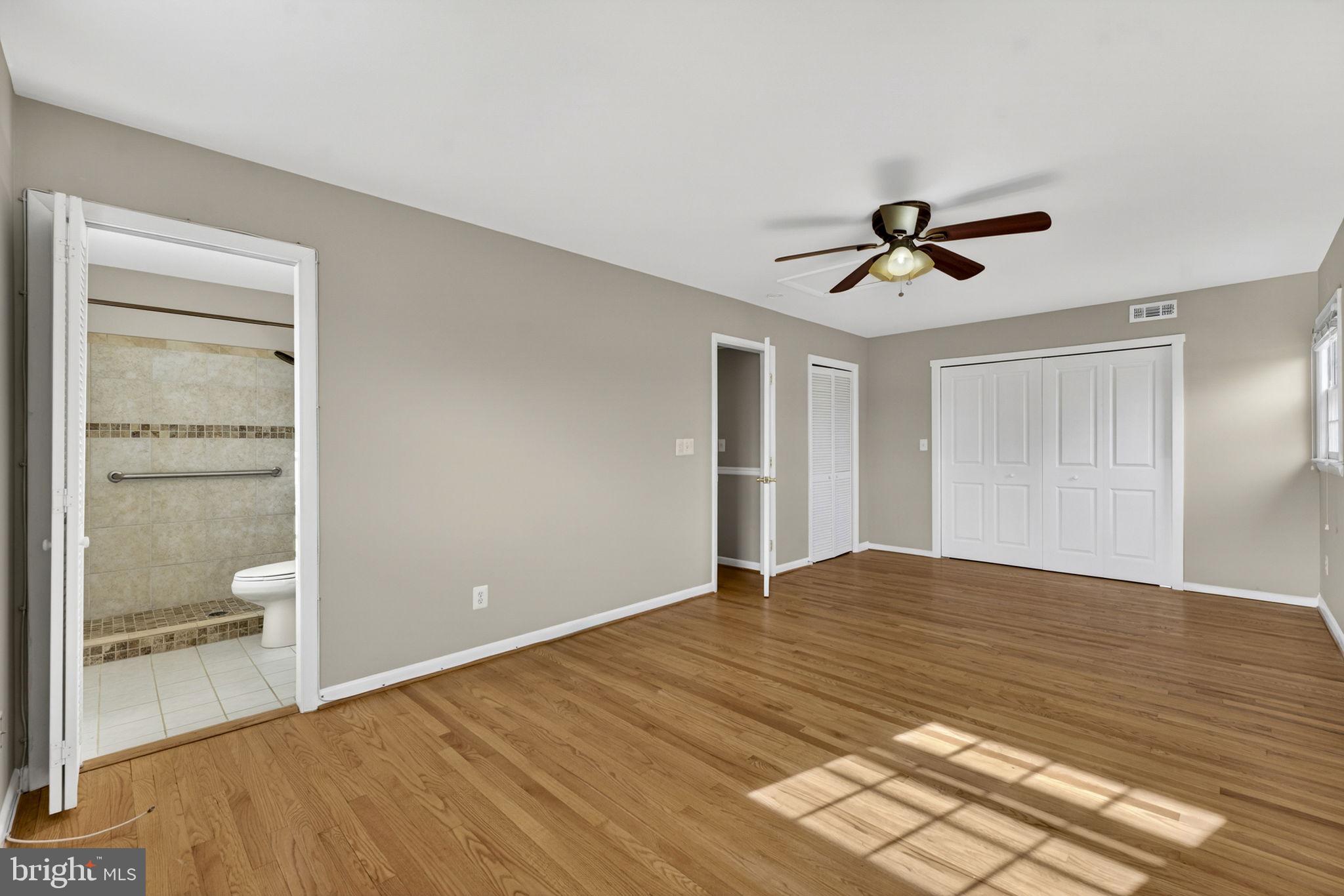 660 Foxcroft Road Warrenton, VA 20186 - Photo 16 of 24 a view of empty room with wooden floor and fan