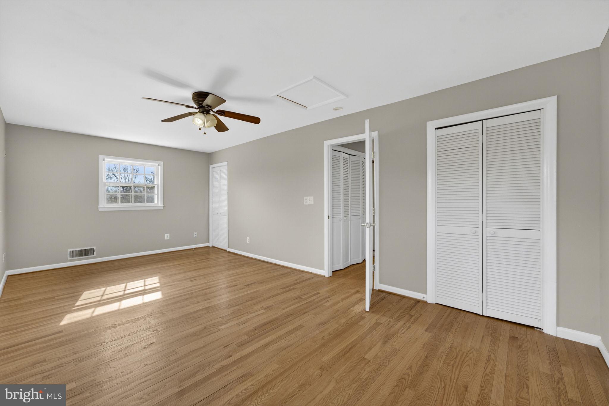 660 Foxcroft Road Warrenton, VA 20186 - Photo 17 of 24 a view of a big room with wooden floor and windows