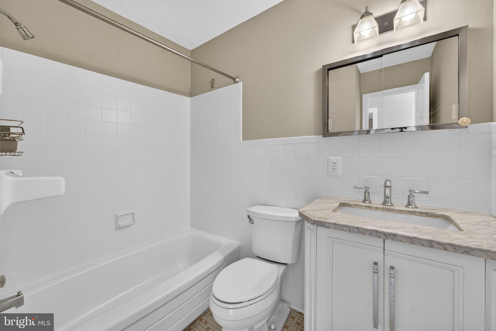 660 Foxcroft Road Warrenton, VA 20186 - Photo 19 of 24 a white toilet sitting next to a bathroom sink