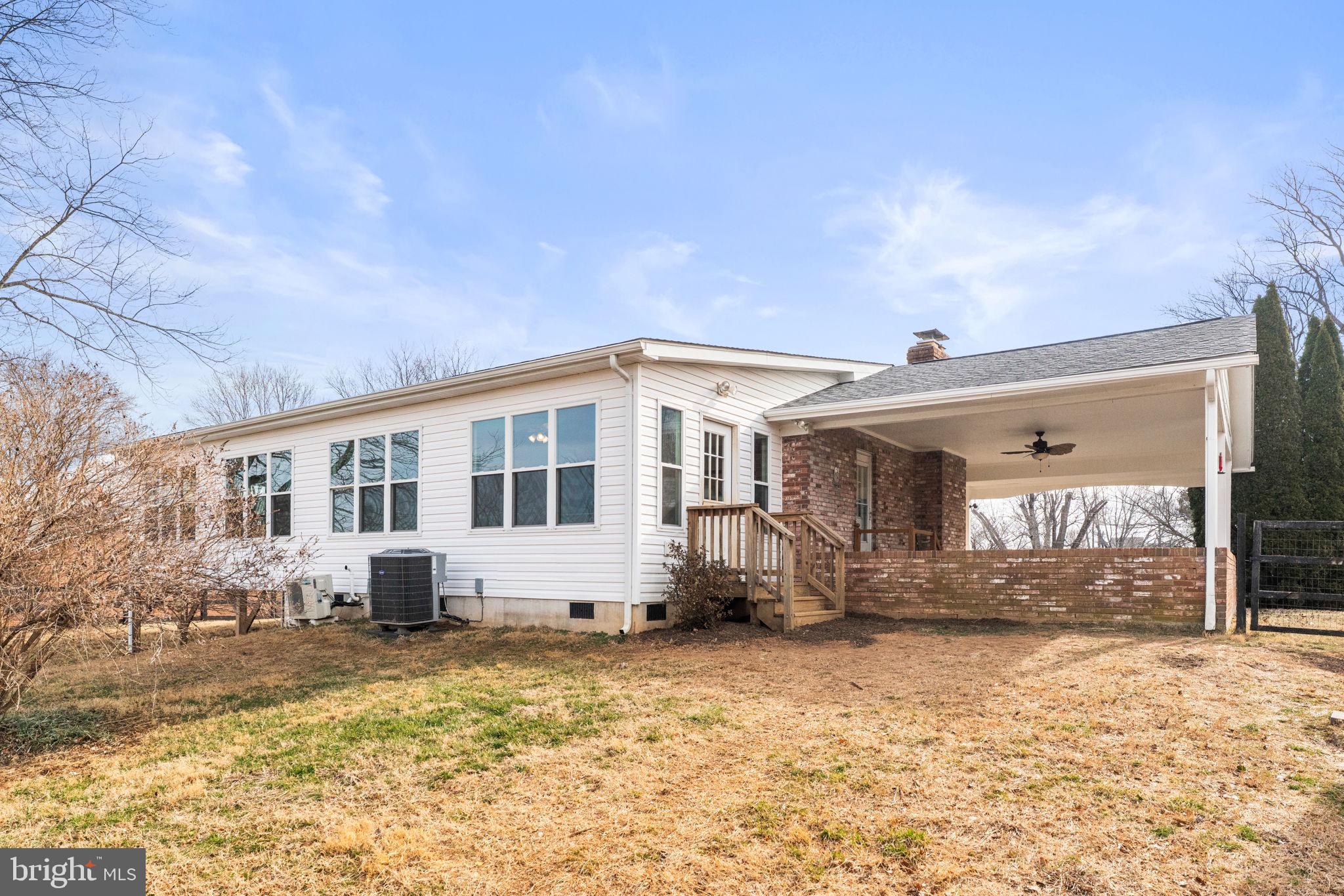 660 Foxcroft Road Warrenton, VA 20186 - Photo 24 of 24 a view of a house with a yard covered in snow