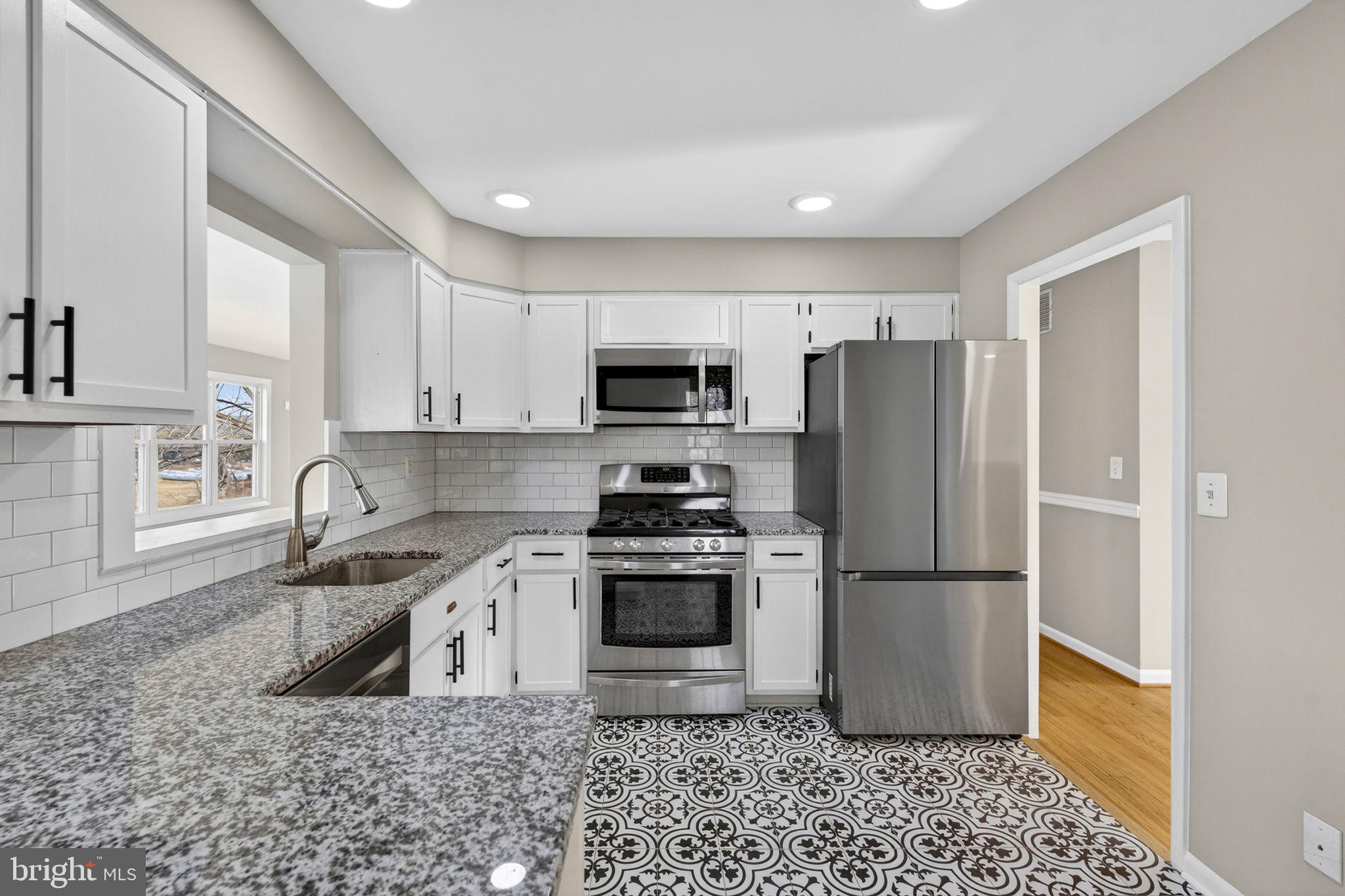 660 Foxcroft Road Warrenton, VA 20186 - Photo 5 of 24 a kitchen with a refrigerator sink and microwave