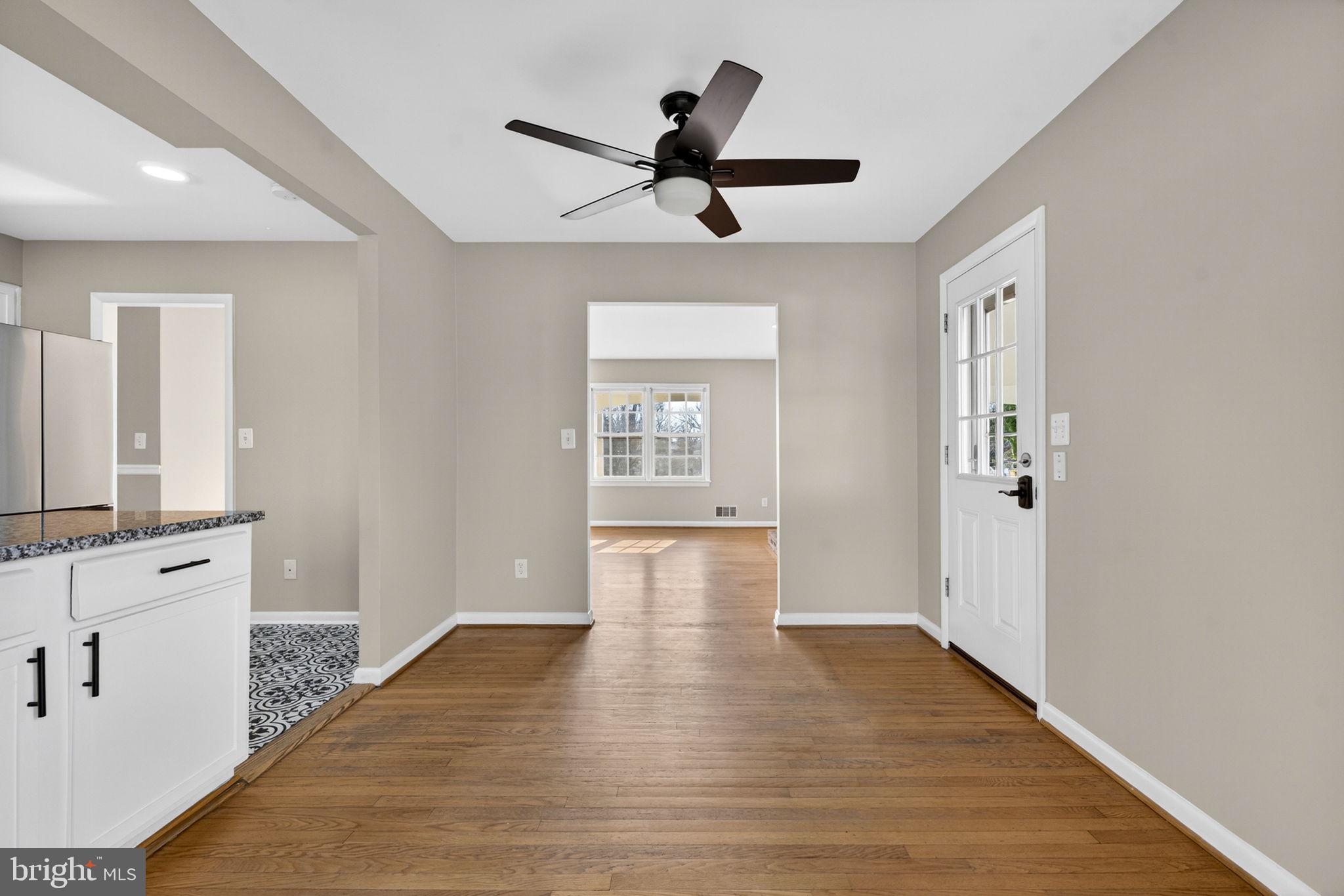 660 Foxcroft Road Warrenton, VA 20186 - Photo 10 of 24 a view of empty room with wooden floor and ceiling fan