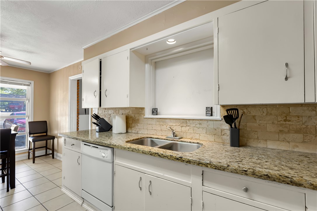 520 Helena Street Bryan, TX 77801 - Photo 11 of 25 a kitchen with a sink and cabinets