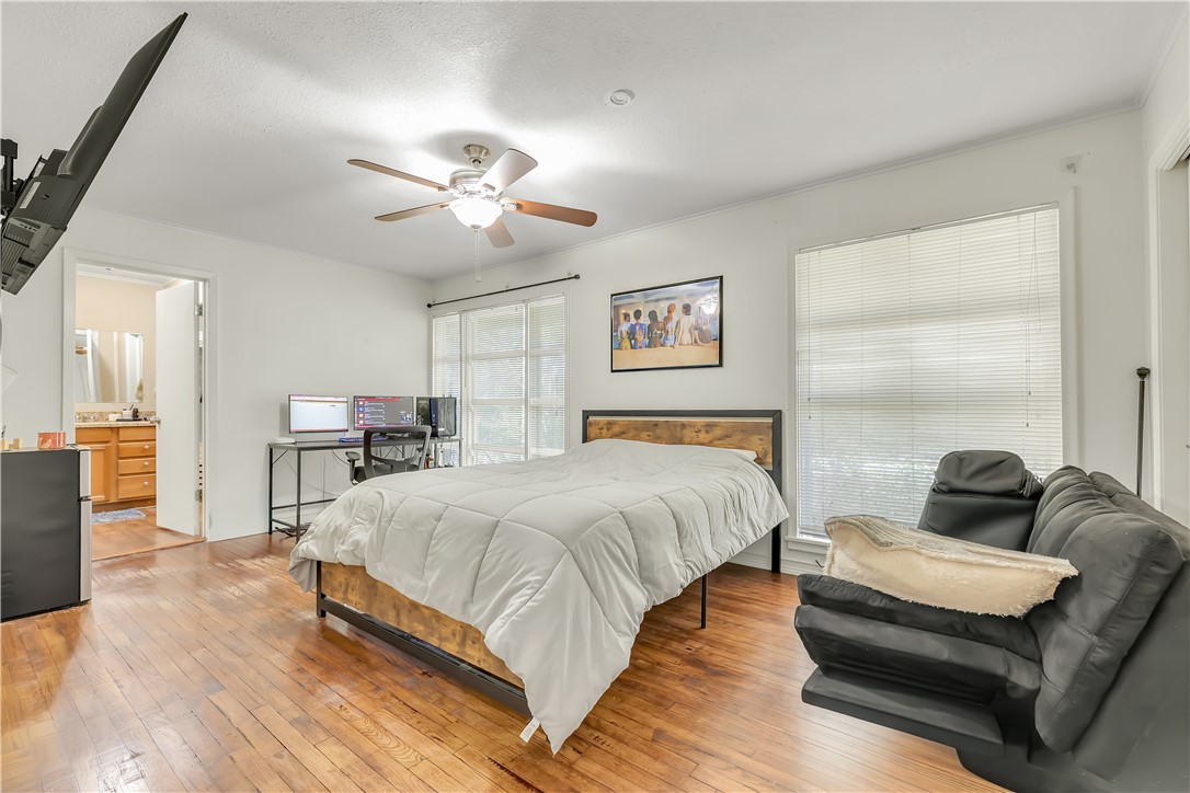 520 Helena Street Bryan, TX 77801 - Photo 13 of 25 a spacious bedroom with a bed and furniture