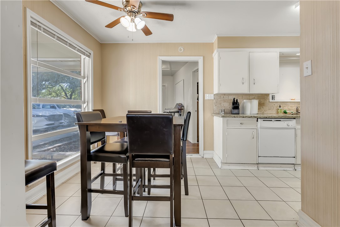 520 Helena Street Bryan, TX 77801 - Photo 15 of 25 a view of a dining room with furniture and wooden floor