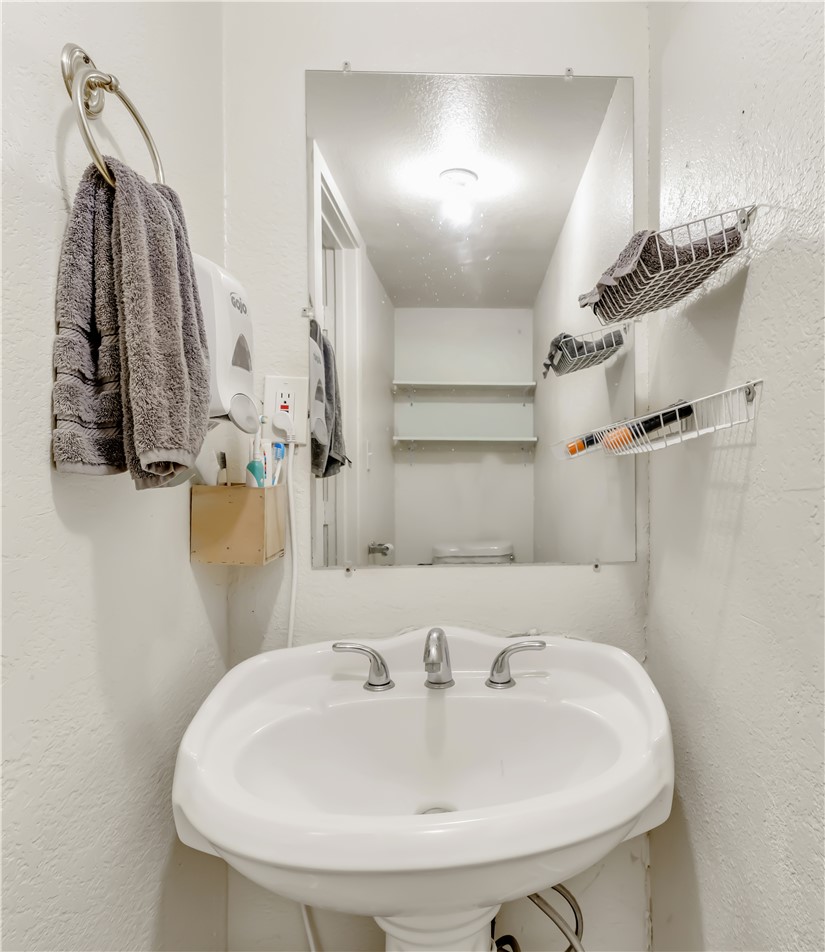 520 Helena Street Bryan, TX 77801 - Photo 19 of 25 a bathroom with a sink and a mirror