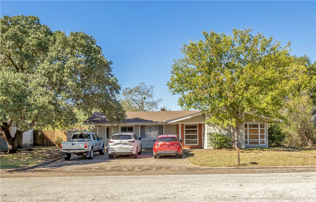 520 Helena Street Bryan, TX 77801 - Photo 2 of 25 a front view of a house with a yard