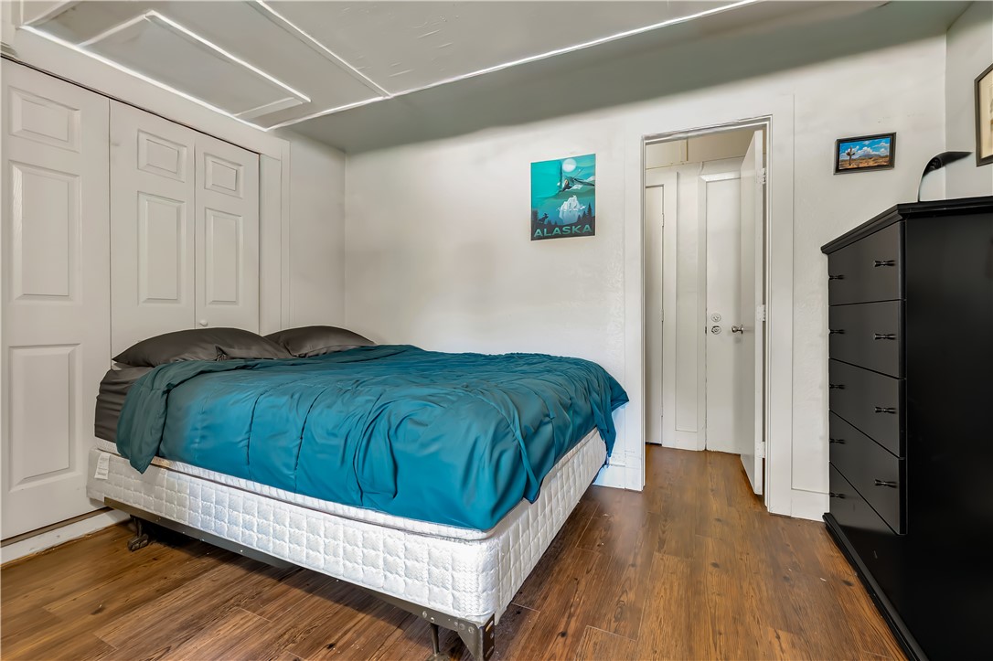 520 Helena Street Bryan, TX 77801 - Photo 21 of 25 a bedroom with a bed and a walk in closet
