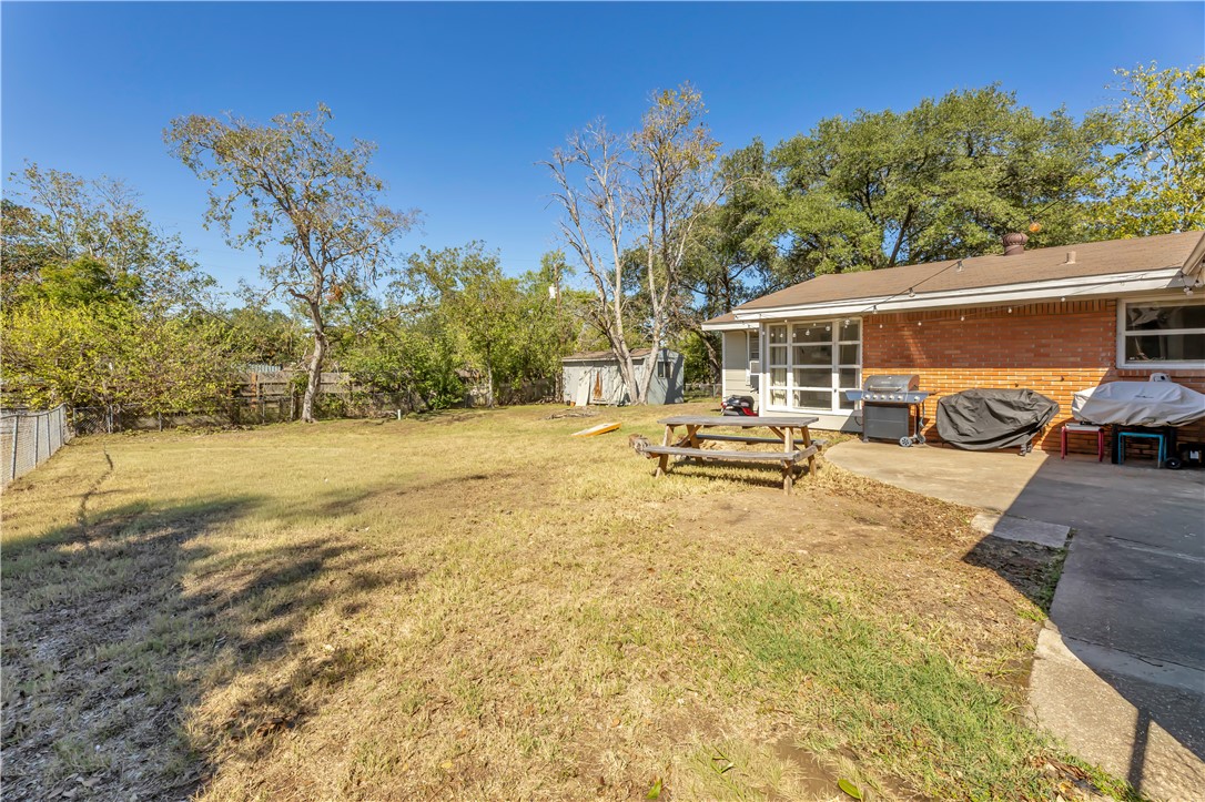520 Helena Street Bryan, TX 77801 - Photo 23 of 25 a view of a yard with cars