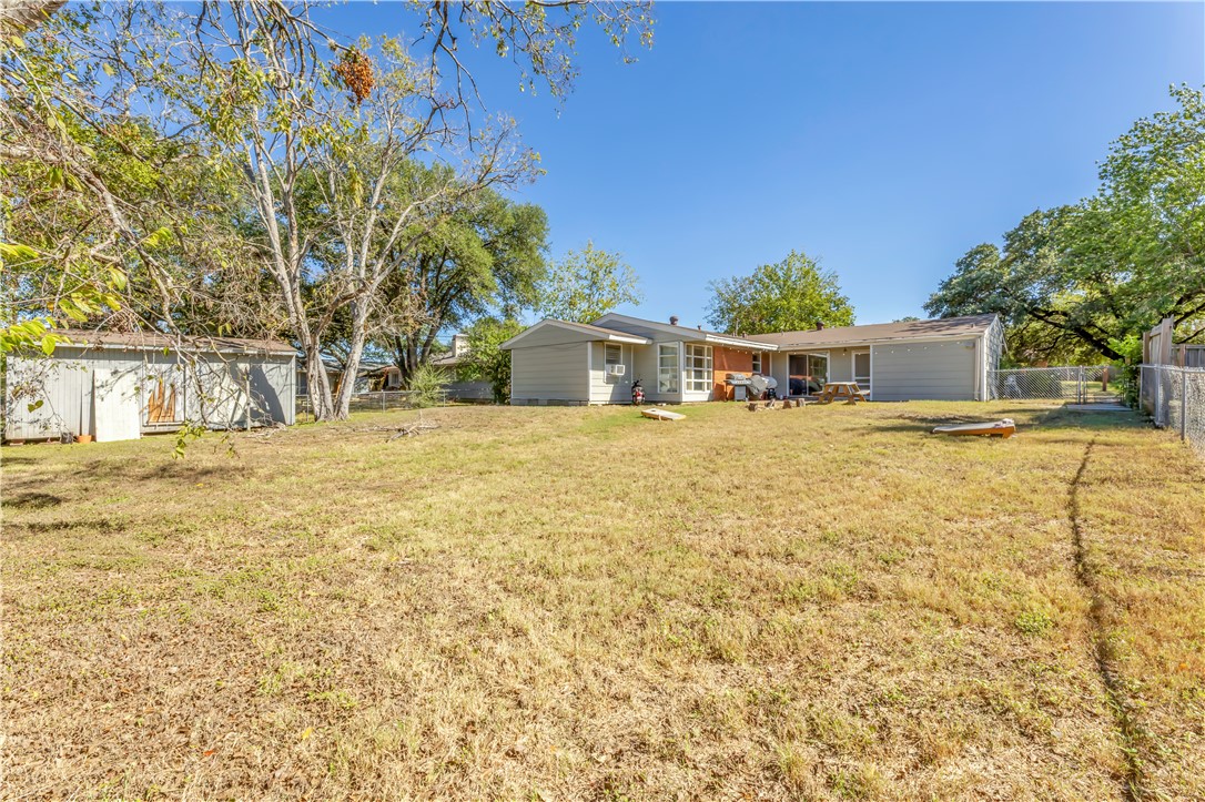 520 Helena Street Bryan, TX 77801 - Photo 24 of 25 a house with trees in front of it