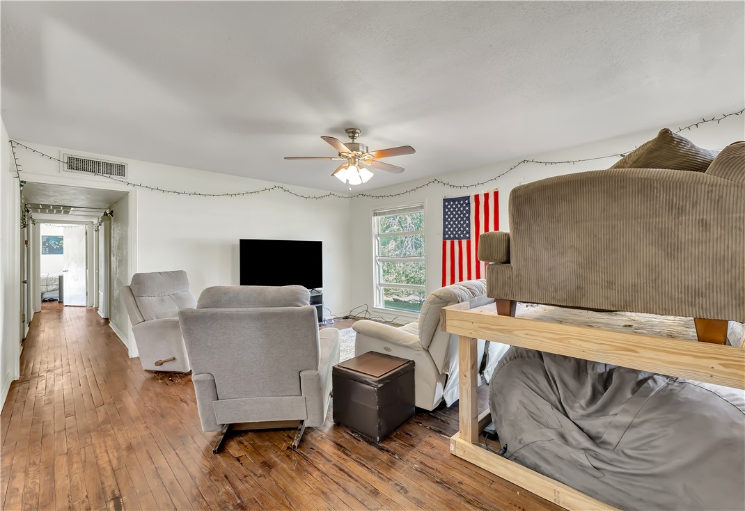 520 Helena Street Bryan, TX 77801 - Photo 5 of 25 a living room with furniture and a flat screen tv
