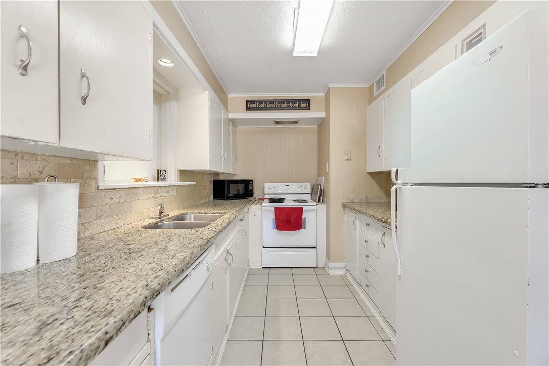 520 Helena Street Bryan, TX 77801 - Photo 9 of 25 a kitchen with a sink stove and cabinets