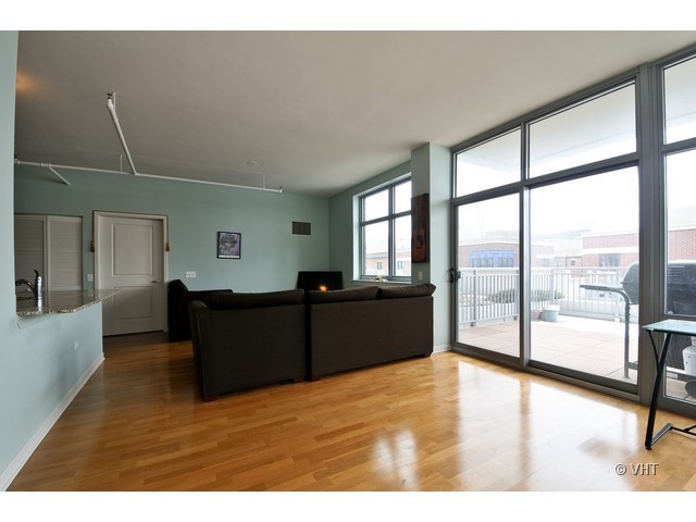 511 West Division Street, Unit 312 Chicago, IL 60610 - Photo 3 of 10 a living room with furniture and a large window