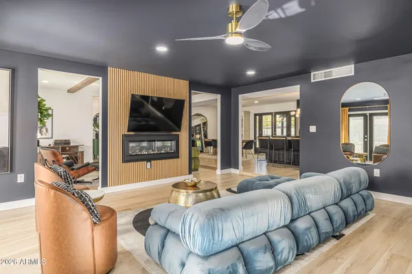 a living room with furniture and a flat screen tv