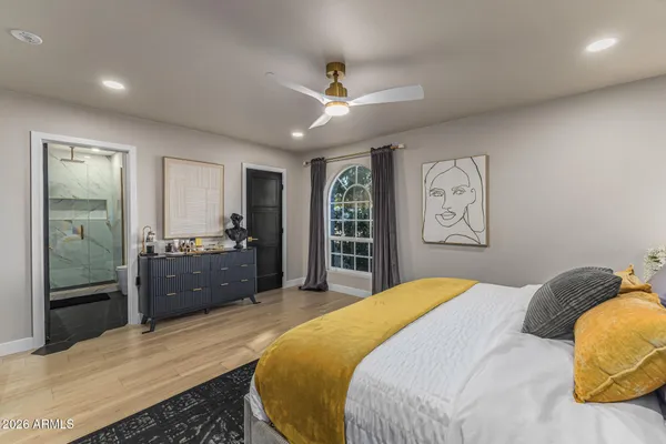 a bedroom with a bed and a dresser