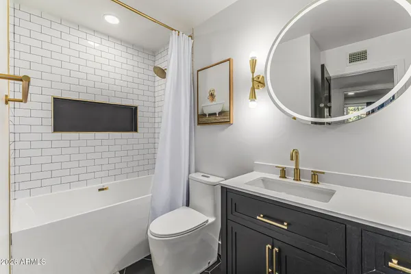 a view of livingroom with washer and dryer