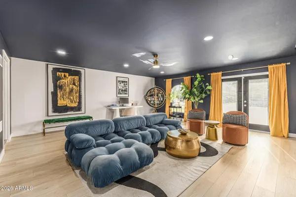 a living room with furniture and a large window