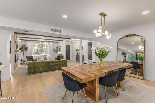 a view of a dining room with furniture window and wooden floor