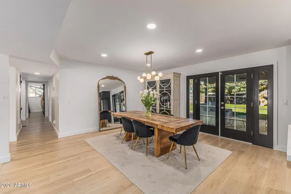 a view of a dining room with furniture window and wooden floor
