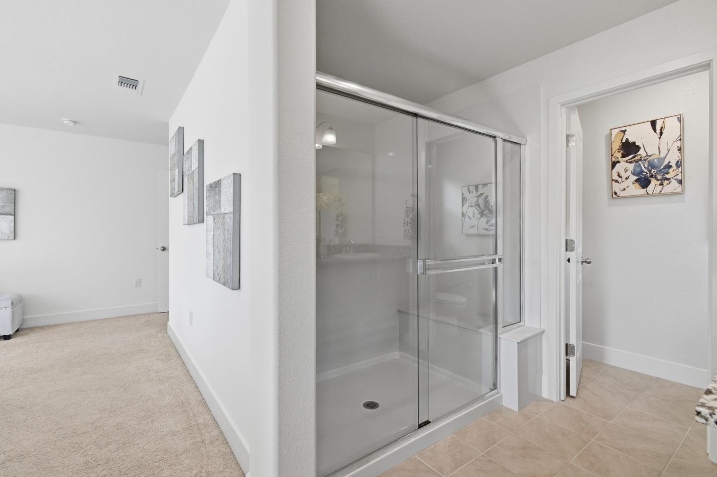 121 Mountaintop Avenue Hayward, CA 94544 - Photo 21 of 38 a bathroom with a shower and a glass door