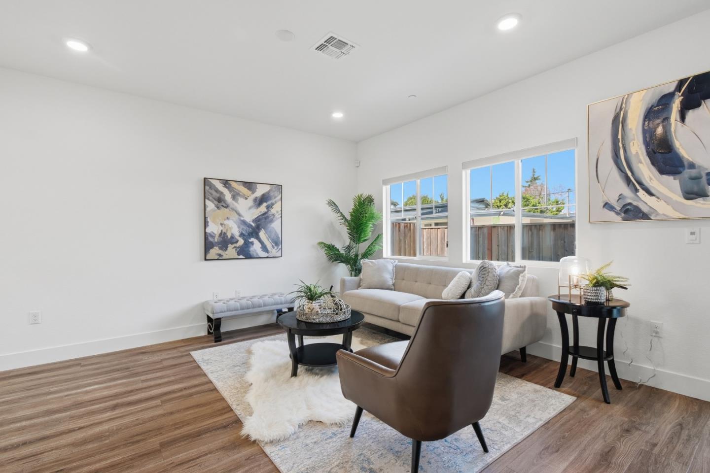 121 Mountaintop Avenue Hayward, CA 94544 - Photo 7 of 38 a living room with furniture a rug and a large window