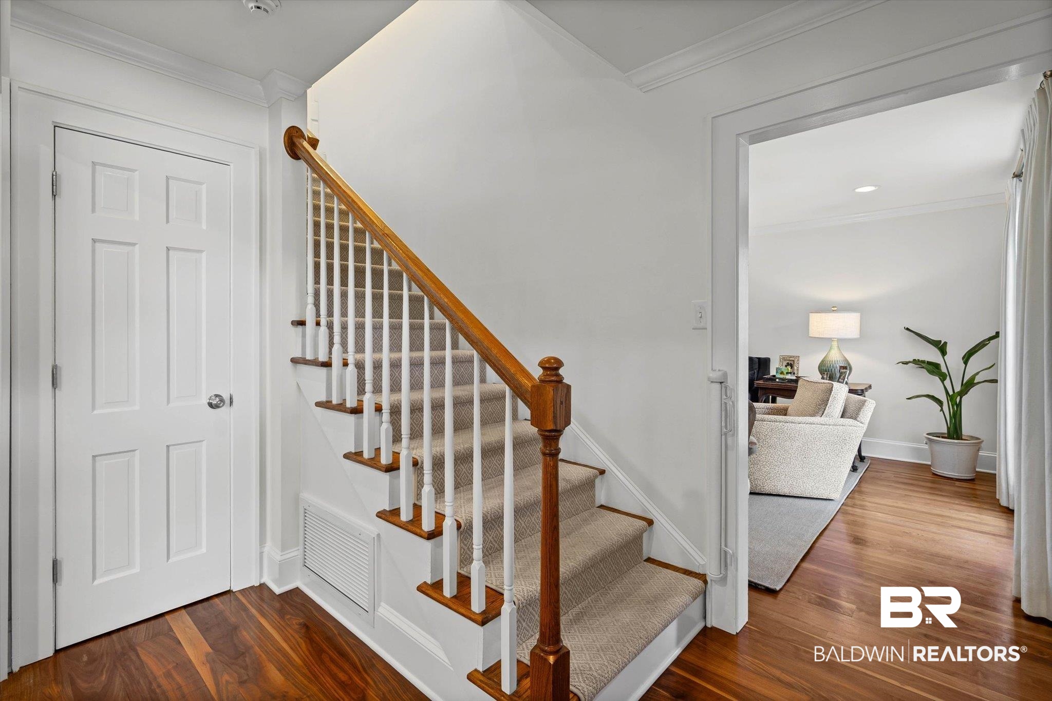 513 Spring Park Drive East Mobile, AL 36608 - Photo 18 of 44 Stairway with crown molding and wood finished floors