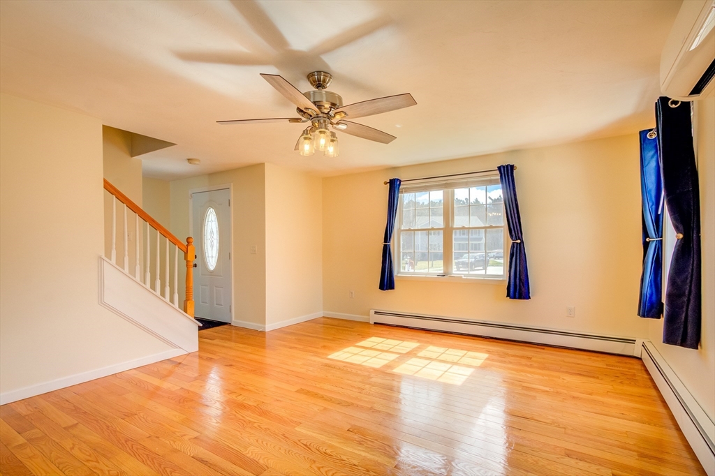 17 Lynne Road Wareham, MA 02571 - Photo 23 of 42 a view of an empty room with window and chandelier fan